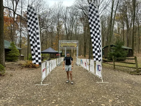 Logan Miller crossing the finish line at the 2025 Fuzzy Fandango trail race